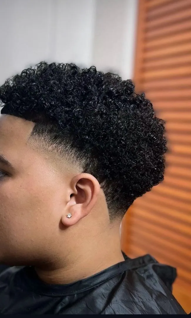 Curly top with a low taper