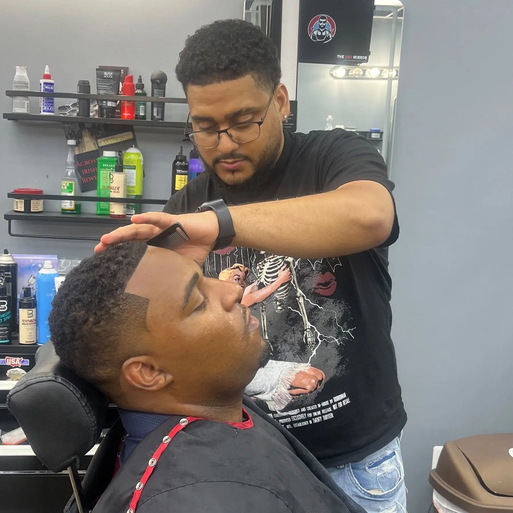 Luis “Domi” Antony lining up a client at Sophisticated Barbershop in Penndel, PA